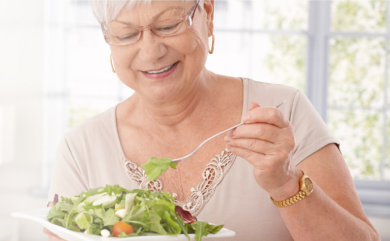 Senior woman enjoying a fresh salad